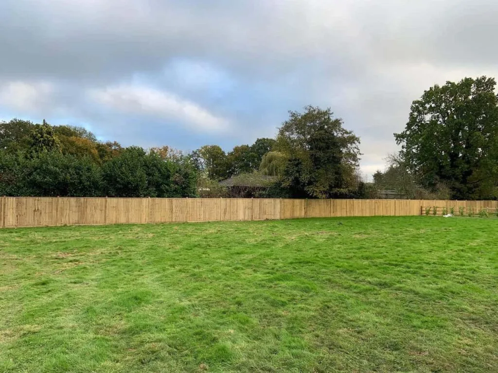 This is a photo of feather edge fencing installed around the edge of a field by Fast Fix Fencing Swanley