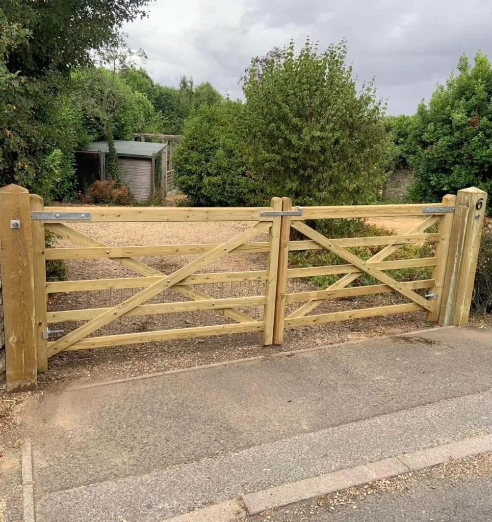 This is a photo of a wooden driveway gate installed by Fast Fix Fencing Swanley